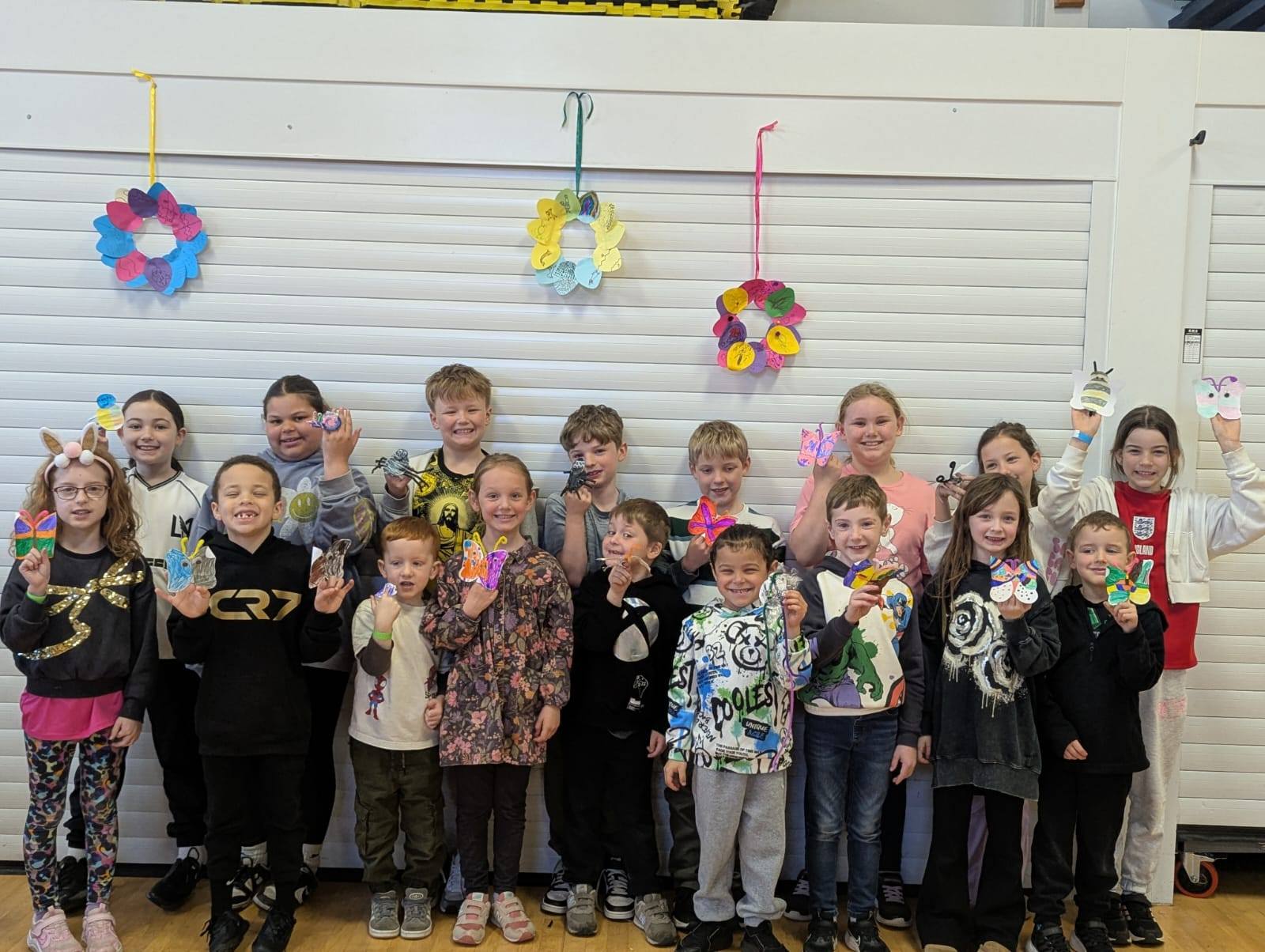 Children holding Easter Crafts in Crewe