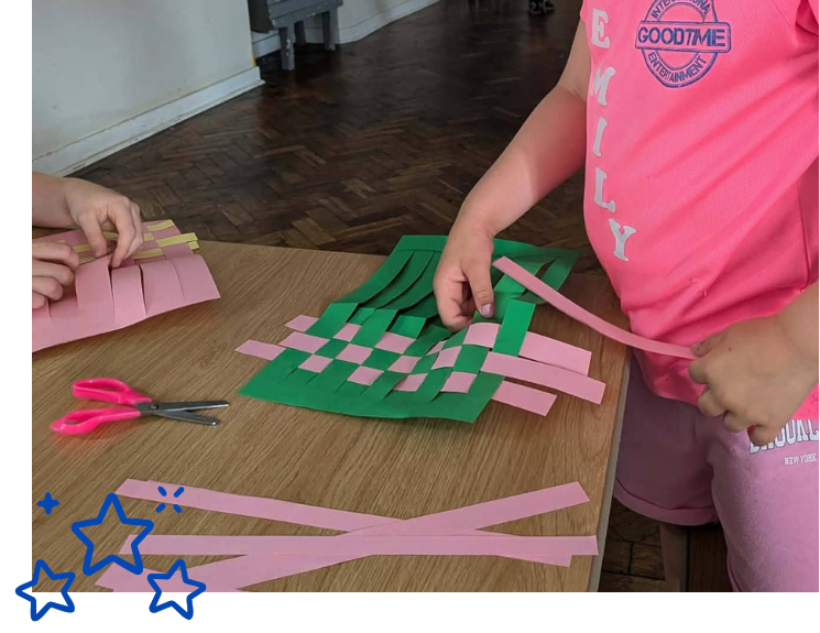 Child weaving paper