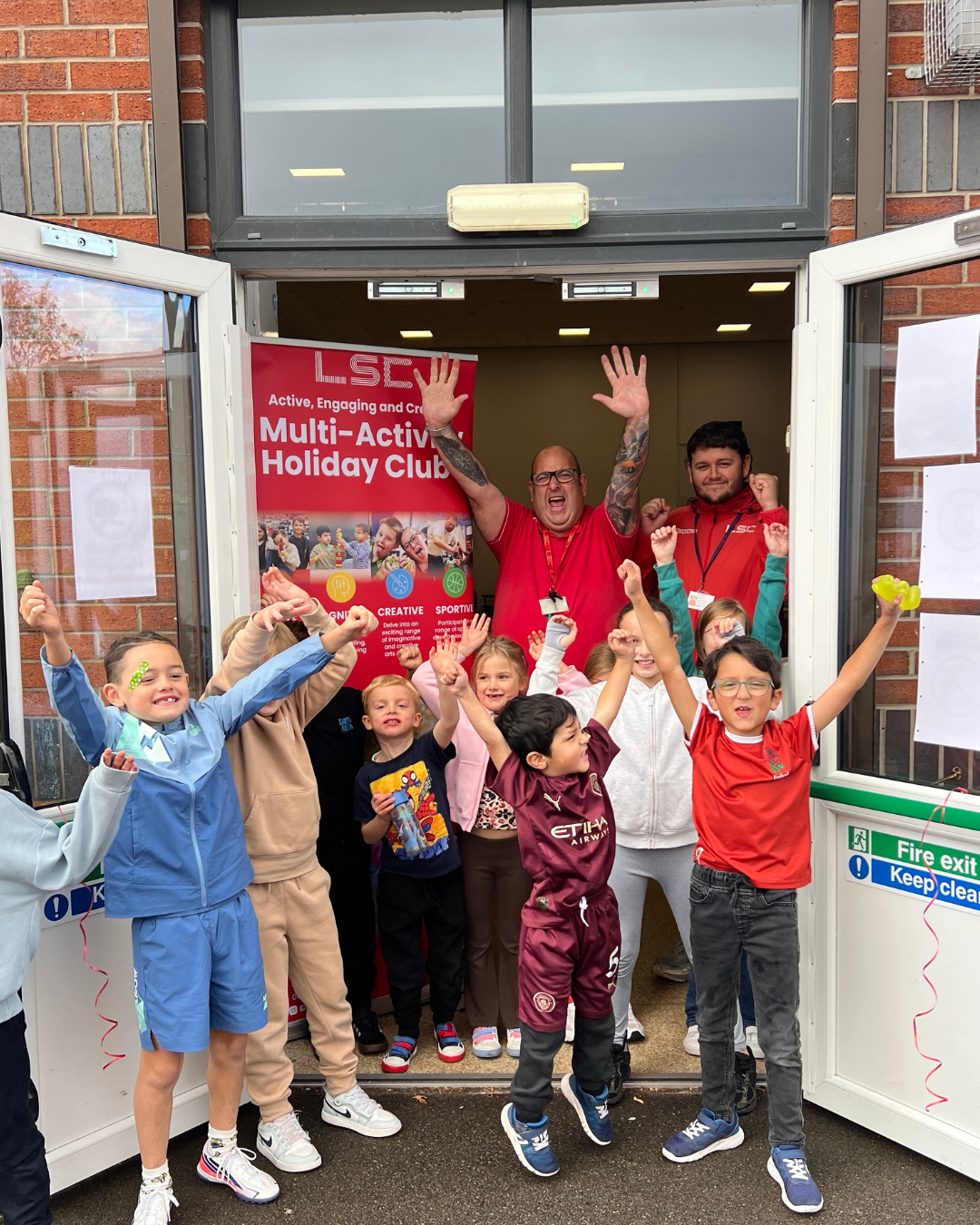 LSC coaches and children celebrating the launch of a new holiday club venue