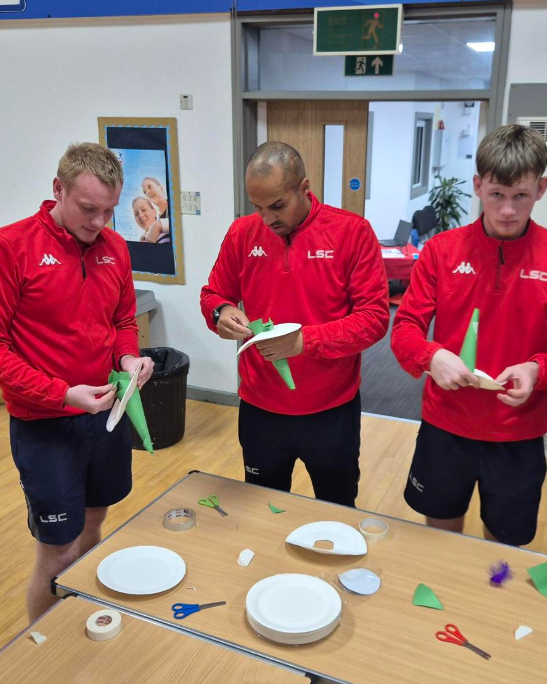 LSC team members participating in a training session and making witches hats