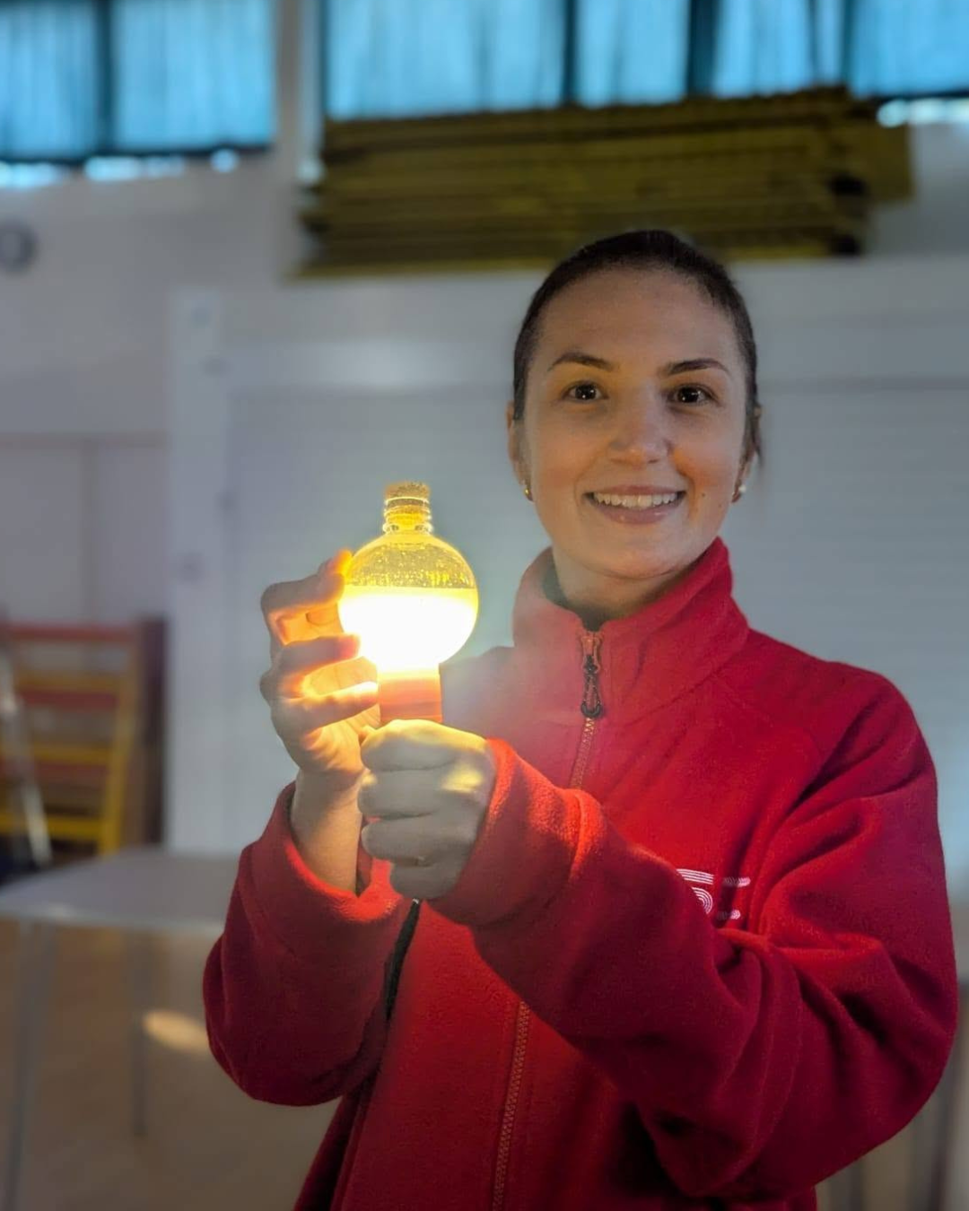 LSC practitioner holding a glowing potion bottle